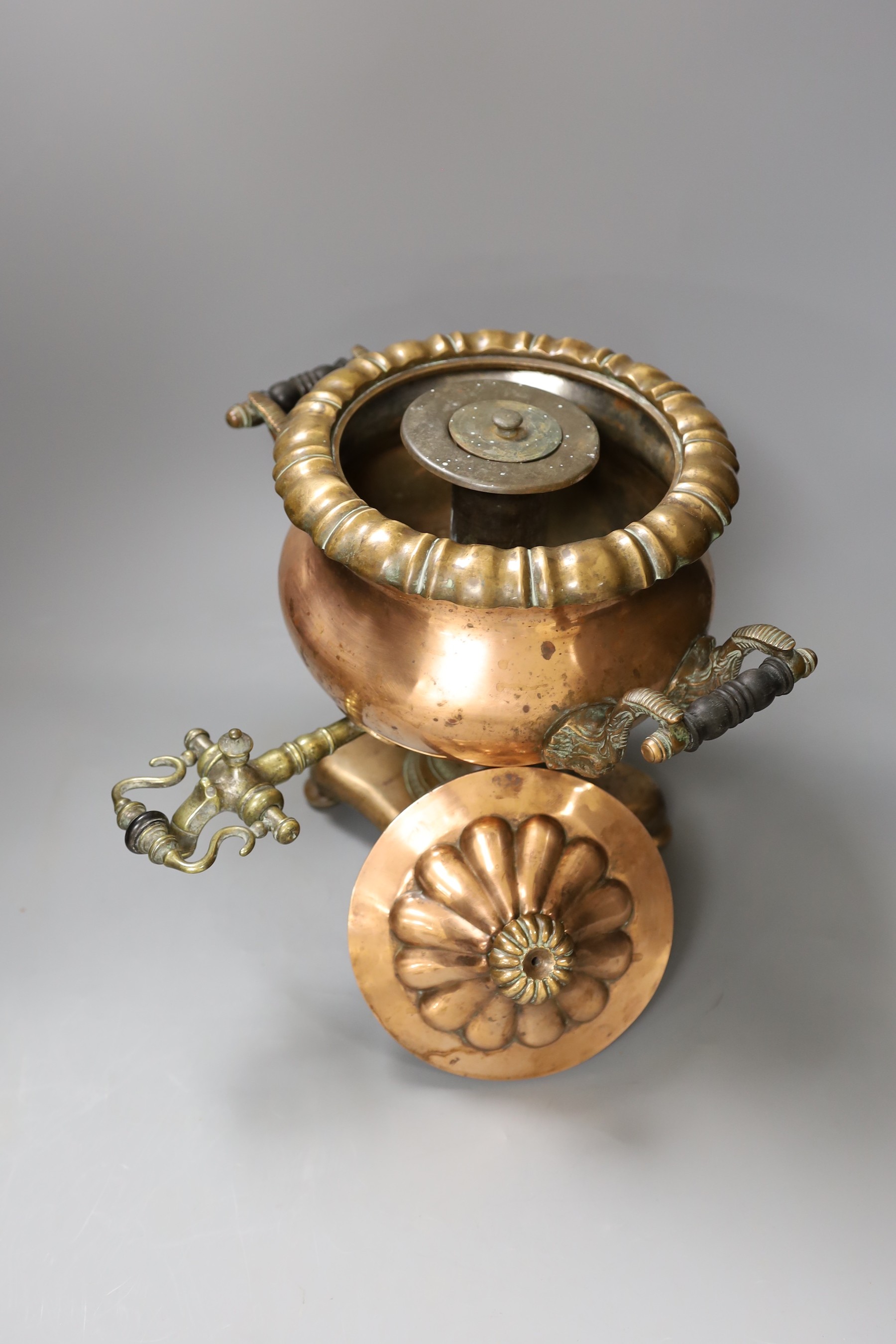 A Victorian copper tea urn